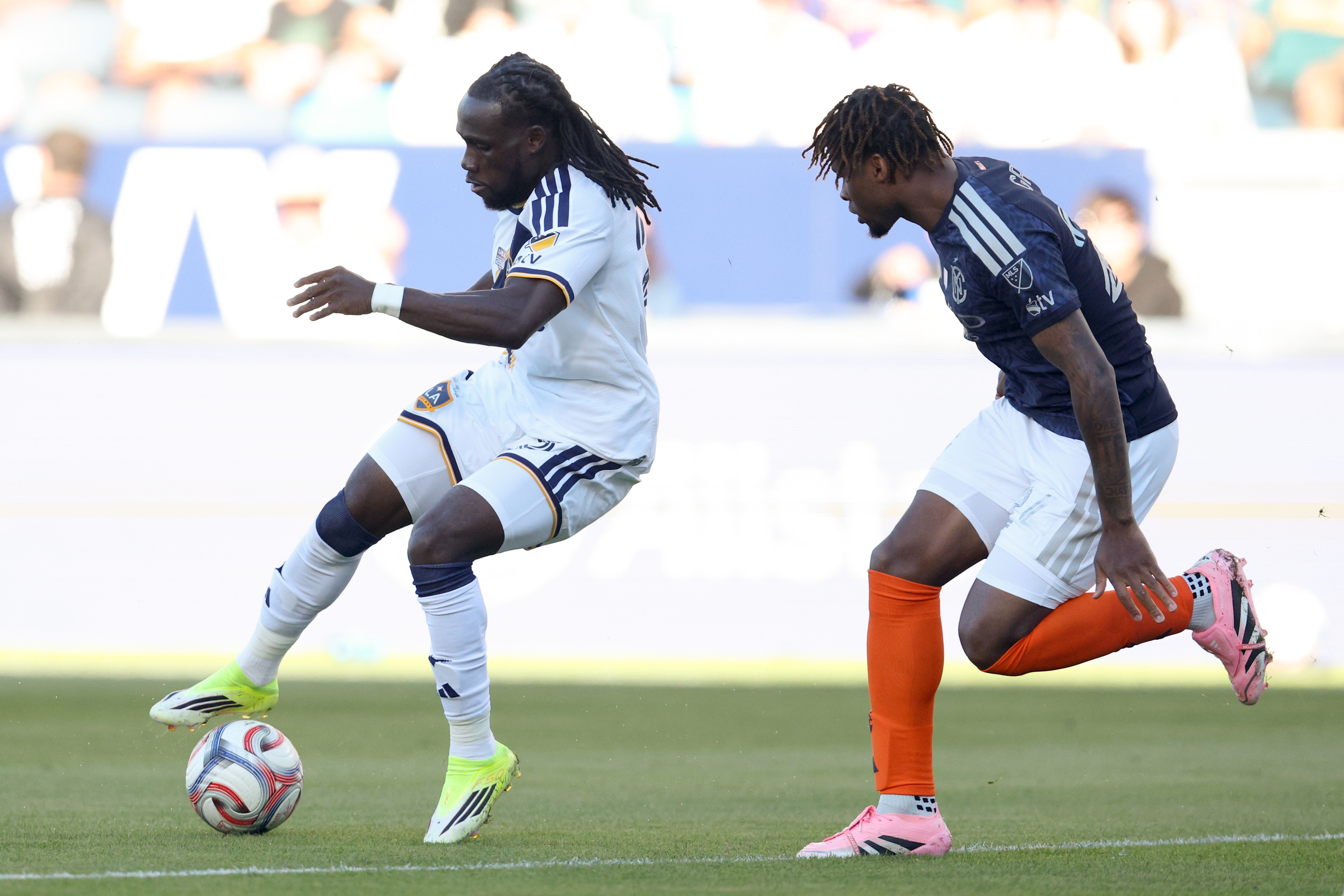 Galaxy forward Joseph Paintsil, left, moves the ball against the...