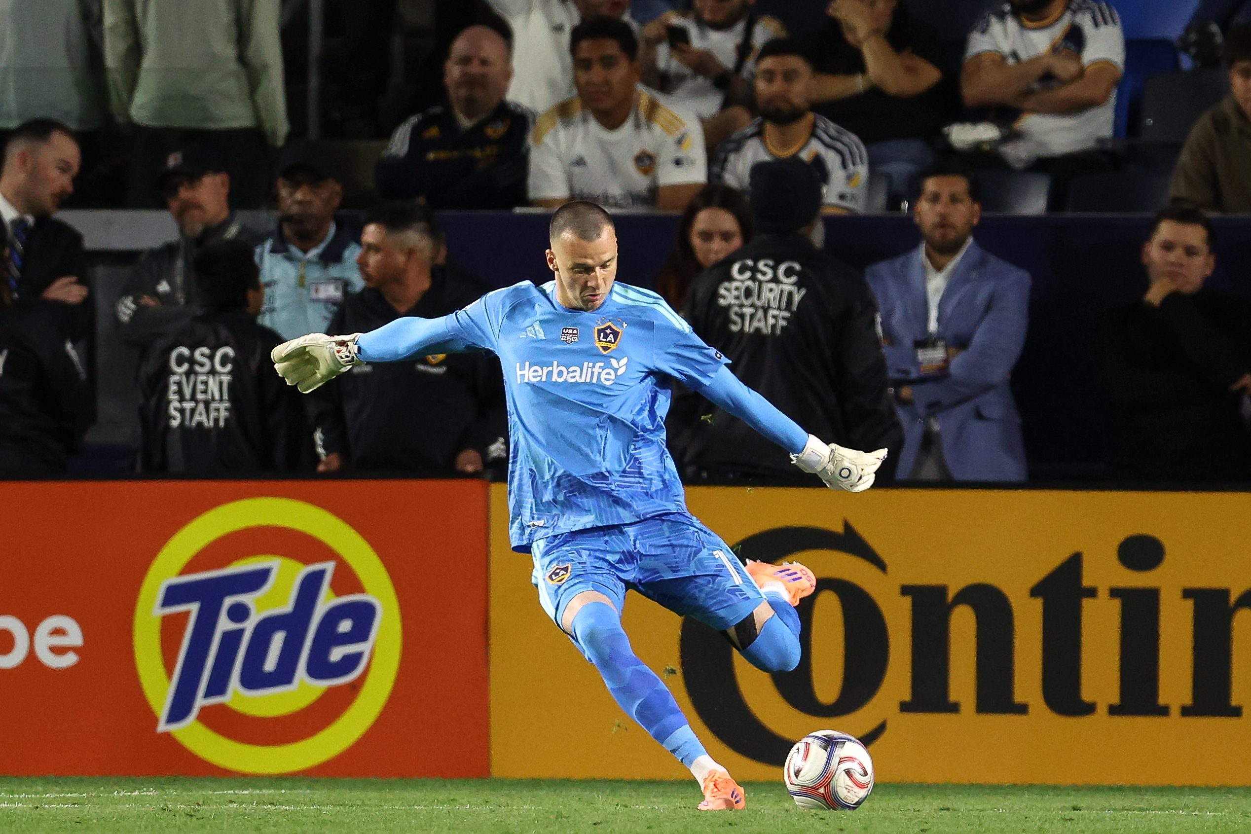 Galaxy goalkeeper Novak Micovic kicks the ball into play against...