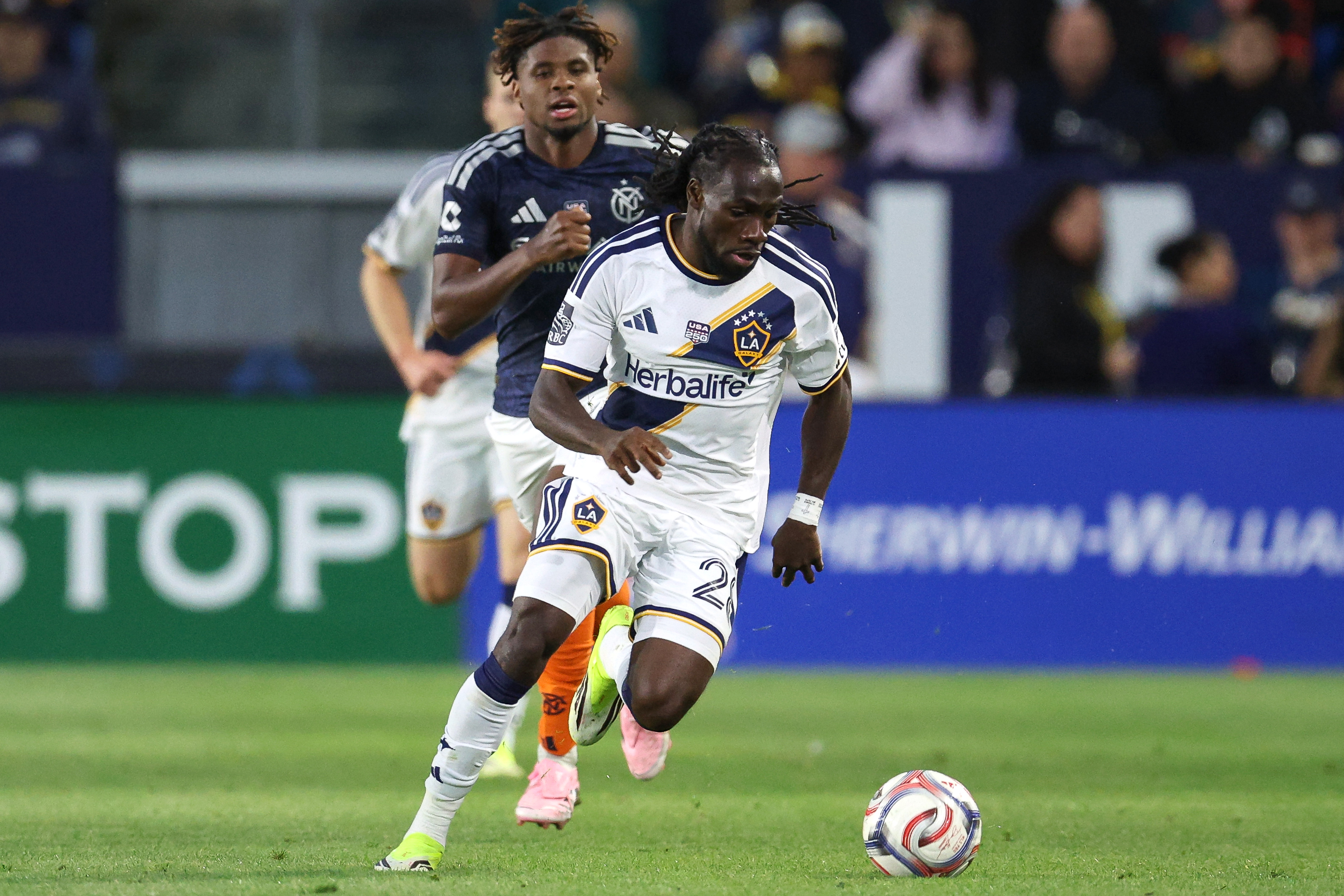 Galaxy forward Joseph Paintsil chases the ball down against the...