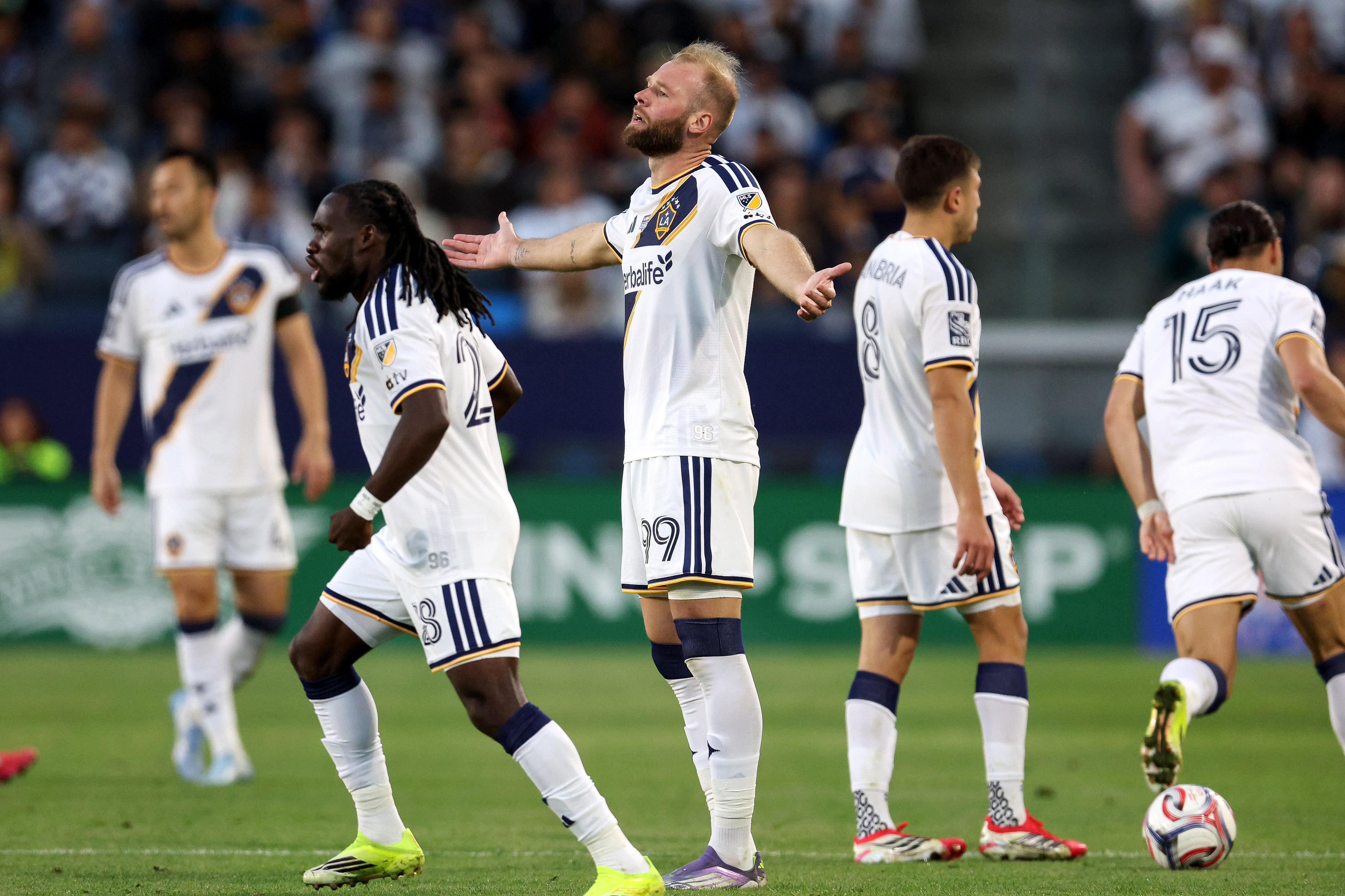 Galaxy forward João Klauss (99) reacts to a referee call...