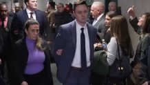 NYPD Officer Ryan McLoughlin is escorted through a court hallway on Friday Feb. 20, 2026