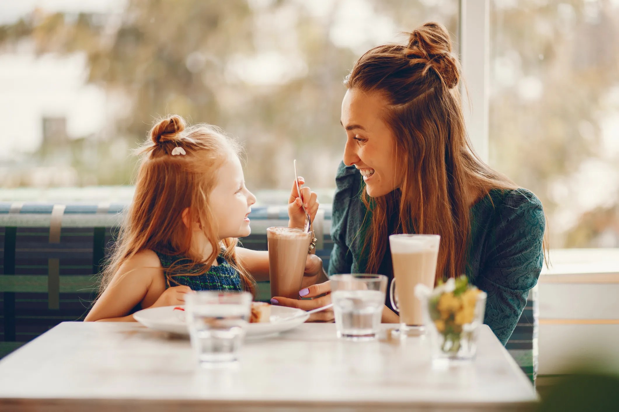 Mom and Me Valentine’s Day Date Ideas in NYC: Coffee Dates and Tea Houses. Mom and daughter enjoying milkshakes in a cafe