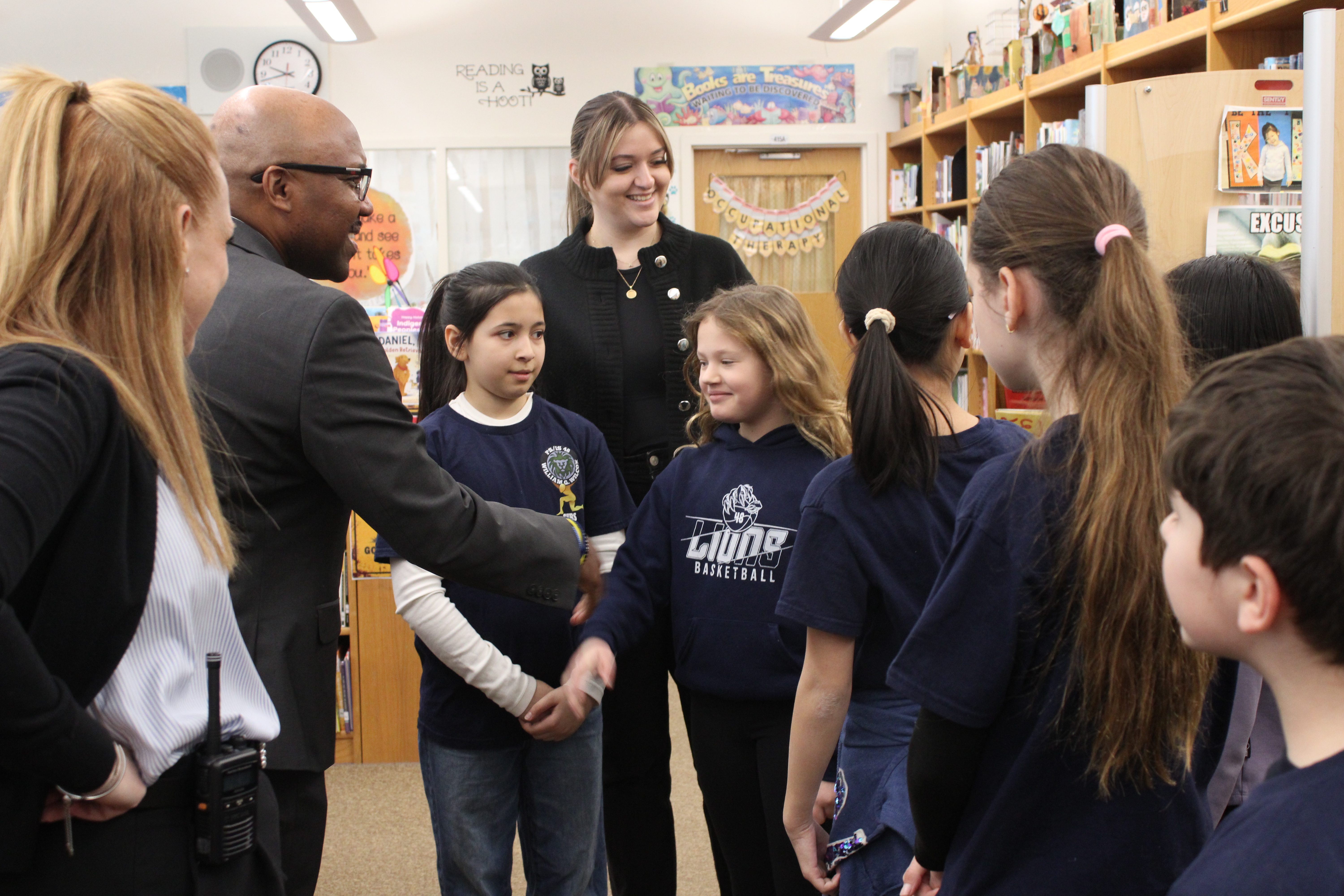 William G. Wilcox (PS/I.S. 48) in Concord hosted the kickoff event for the tenth annual campaign, where District Attorney Michael E. McMahon emphasized how childhood bullying can lead to criminal conduct in adulthood. Dr. Roderick Palton, the current Superintendent for Staten Island’s public schools, greets students at the library.