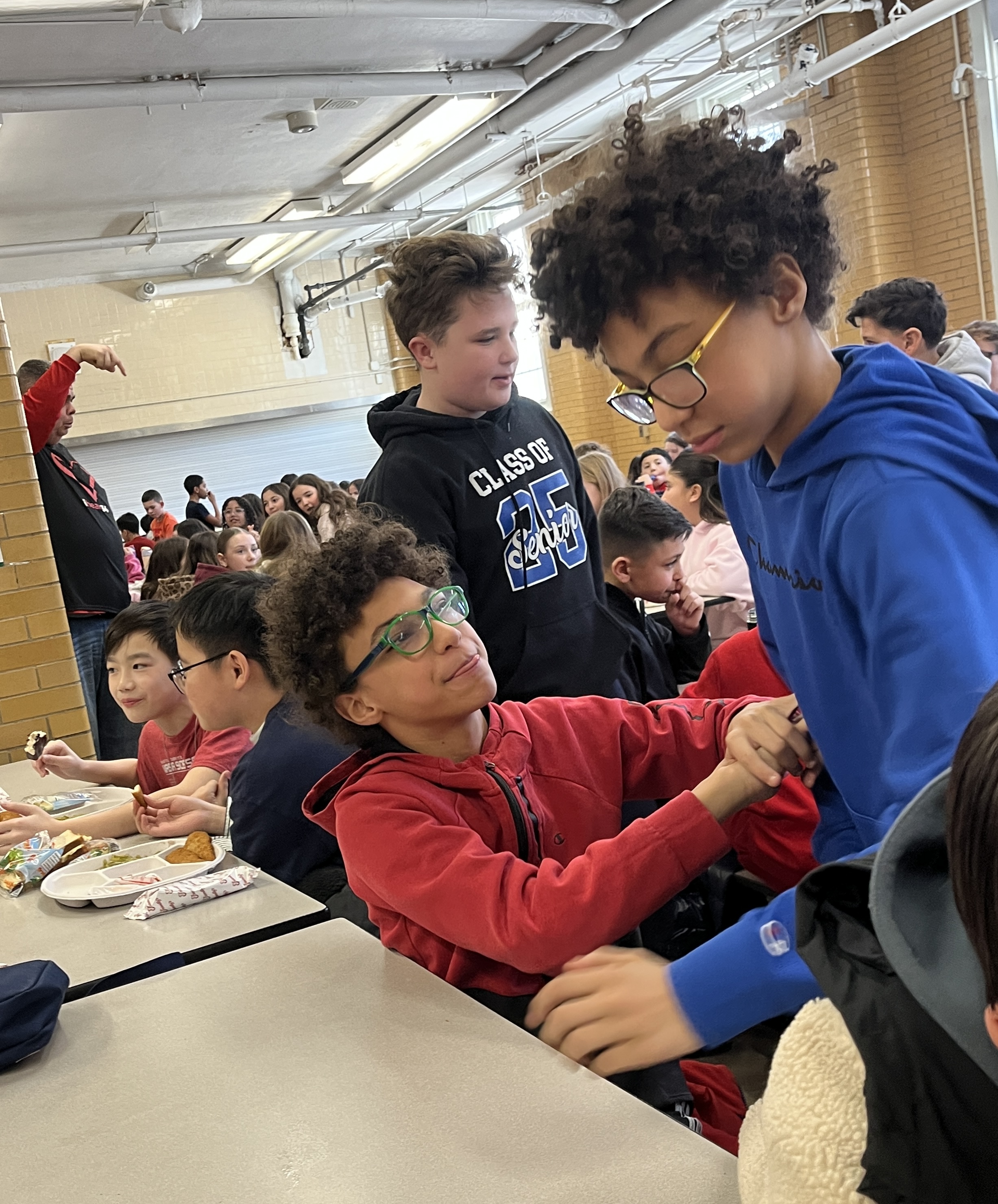Millions of schools across the United States, including some on Staten Island, like I.S. 34 in Tottenville, took part in National No One Eats Alone Day. The lunchtime program, created by the nonprofit Beyond Differences, aims to make cafeterias more welcoming by encouraging students to connect with classmates they might not usually sit with. Today’s lunch also featured dancing. (Advance/SILive.com | Jan Somma-Hammel)