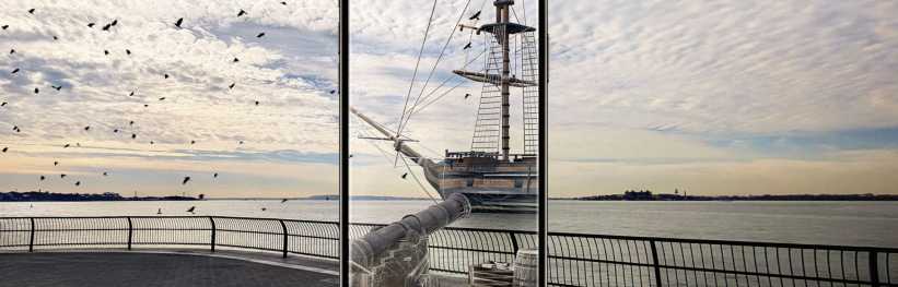 Shot of an old ship in New York Harbor, depicting the NYC Revolutionary Trail. 