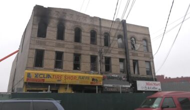 According to FDNY officials, the fire broke out in a tire shop on the ground floor, quickly spreading to all three stories of the building. (Spectrum News NY1)