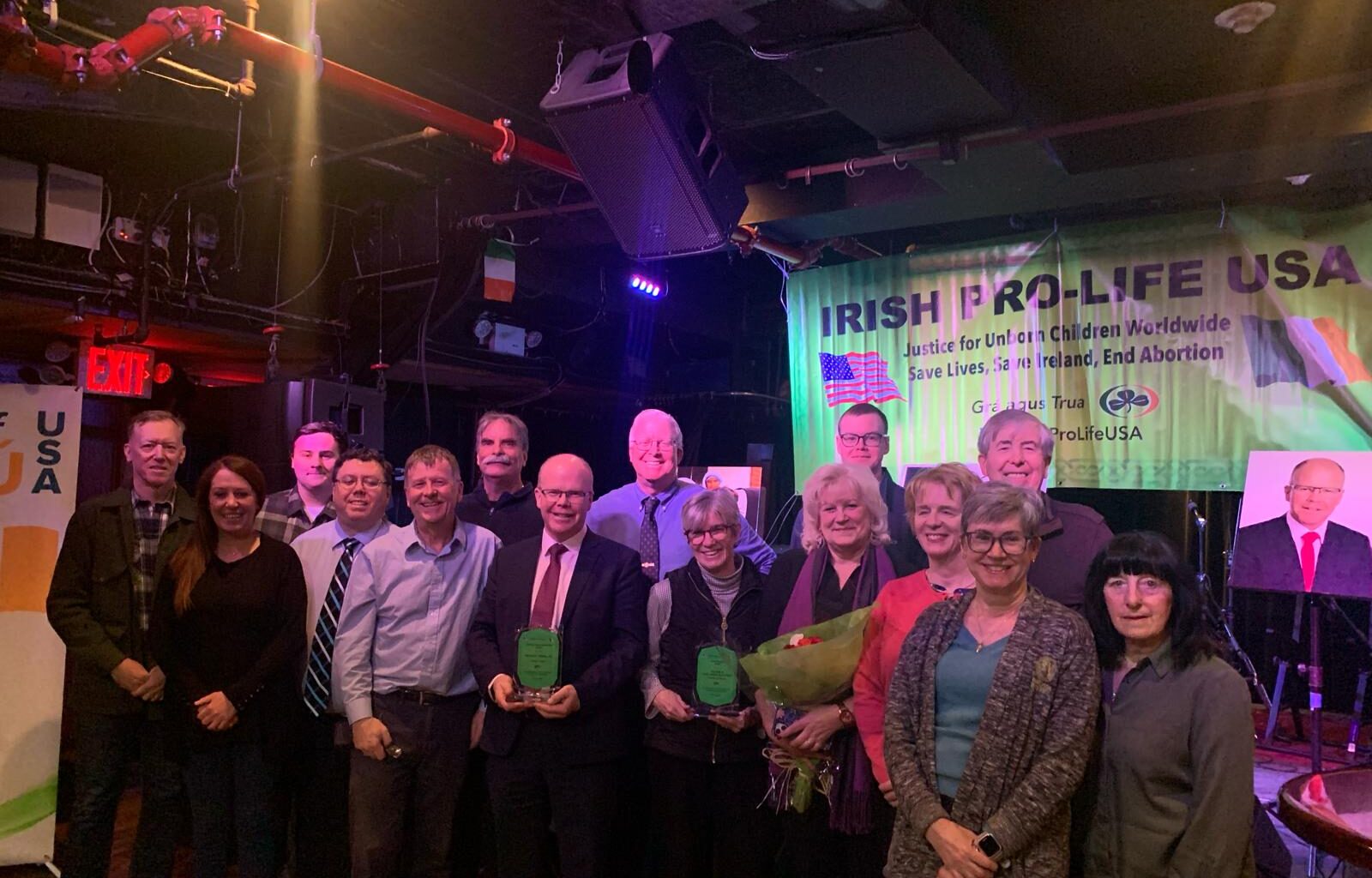 Peadar Tóibín TD (center, holding award), leader of Irish political party Aontú, and Eileen Slattery (center right, holding award), pose with members of Irish Pro-Life USA at an event held in their honor at Connolly’s Times Square in Manhattan on February 3, 2026.