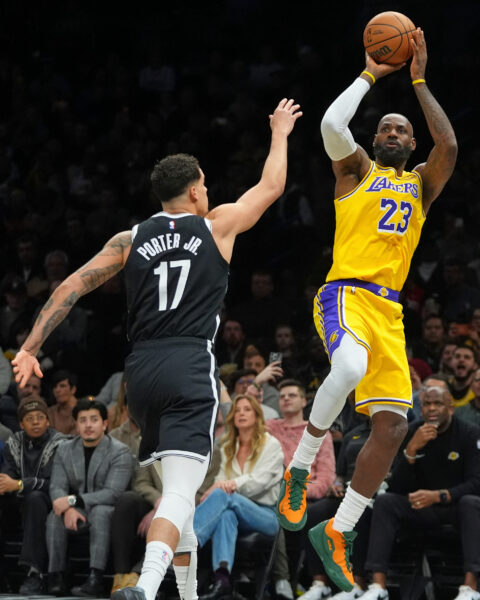 Los Angeles Lakers' LeBron James (23) shoots over Brooklyn Nets' Michael Porter Jr. (17) during the first half of an NBA basketball game Tuesday, Feb. 3, 2026, in New York. (AP Photo/Frank Franklin II)