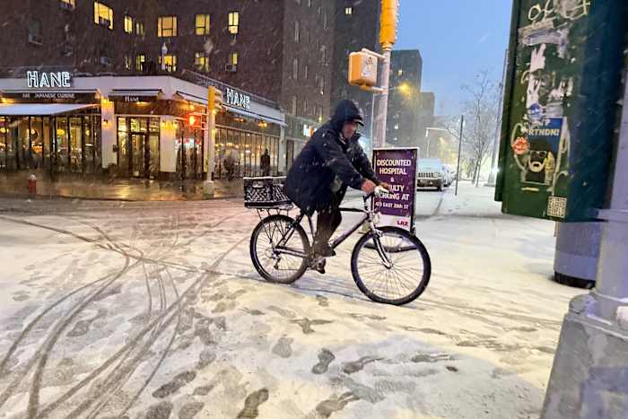 New York City hunkers down under blizzard warnings and a travel ban as winter storm hits Northeast