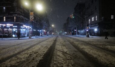 Snow falls in the Alphabet City neighborhood of New York, Sunday evening.