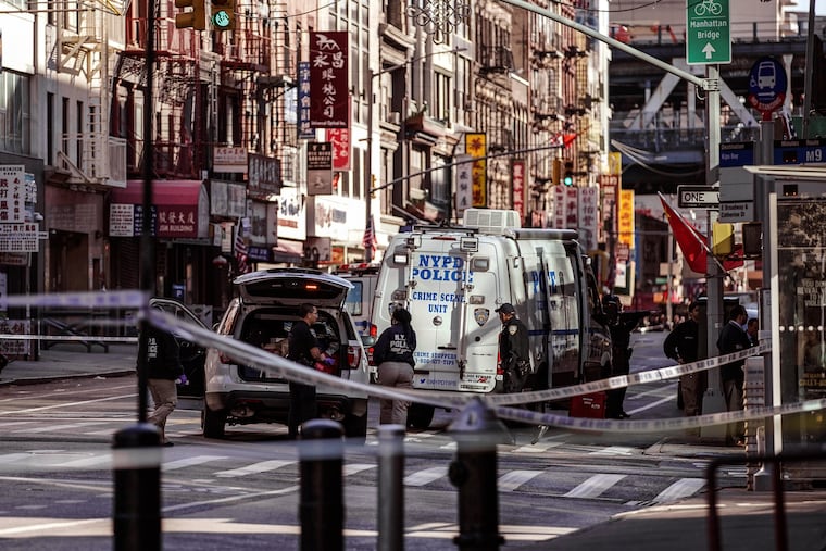 Police officers investigate the scene of an attack in Manhattan's Chinatown neighborhood on Oct. 5, 2019.