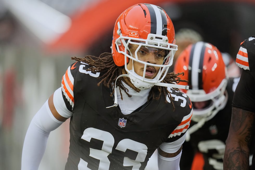 Cleveland Browns safety Ronnie Hickman (33) runs onto the field before an NFL football game...