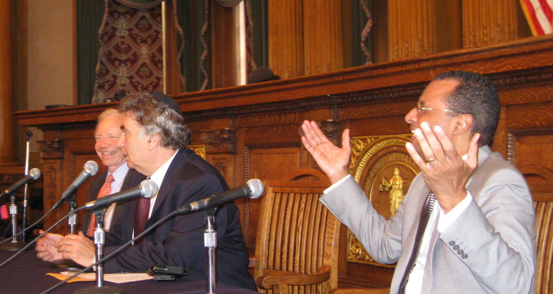 Pastor A.R. Bernard, at right, expressively makes a point during a panel discussion with the late Senator Joseph Lieberman and Rabbi Joseph Potasnik at a 2011 Borough Hall panel discussion on Lieberman’s book. The forum was held in conjunction with the Brooklyn Book Festival. Photo: Francesca N. Tate/Brooklyn Eagle