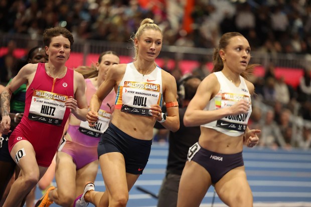 Aptos native Nikki Hiltz, from left, challenges for the lead against Australian Jessica Hull and American Sinclaire Johnson in the Wanamaker Mile at the 2026 Millrose Games in New York on Sunday. (John Nepolitan - Armory Track)
