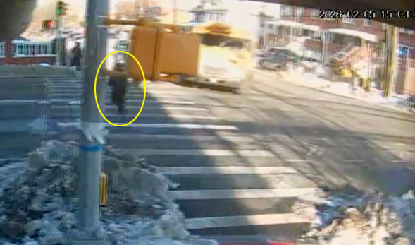 Screengrab from a video shows the girl as she was crossing at Bath and 23rd Aves. as the bus approaches. (Obtained by Daily News) 