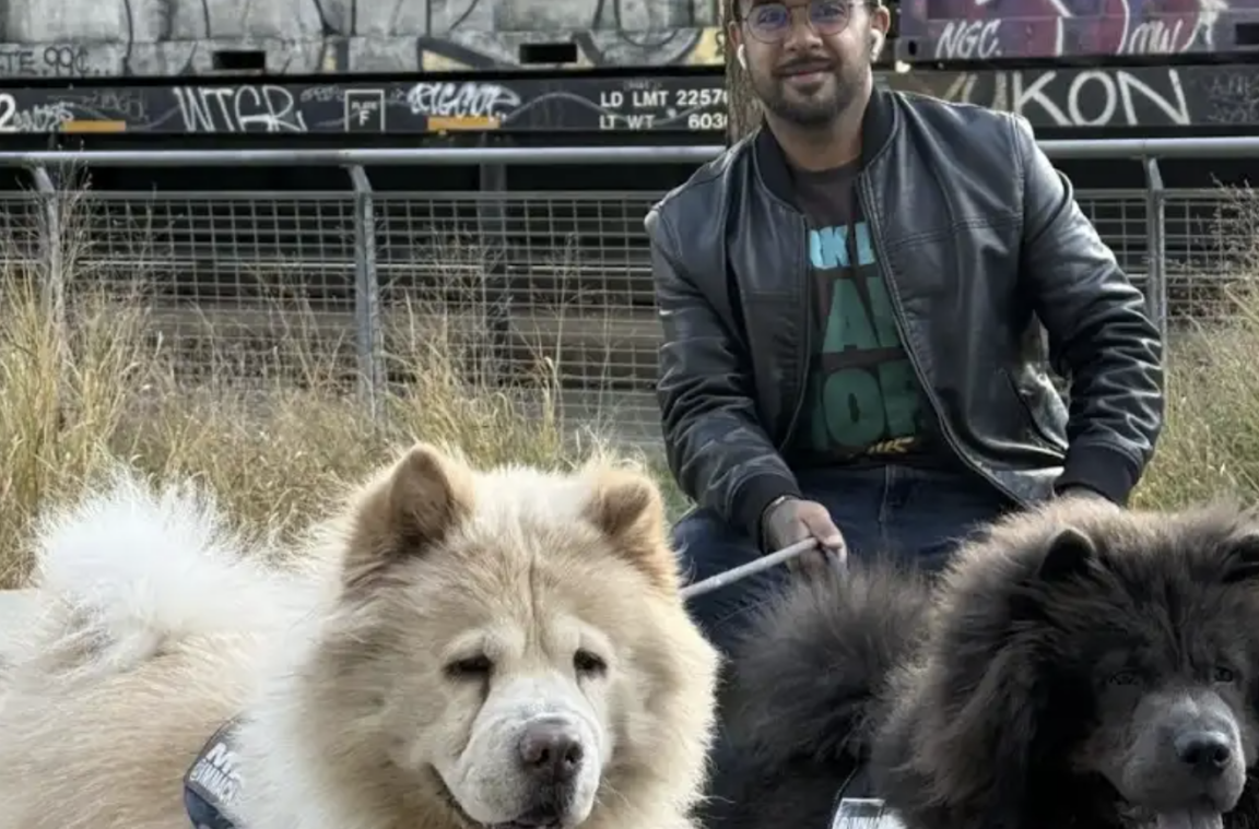 Jonas Silva with his two dogs at Bankside Park. Photo by Carol Chen
