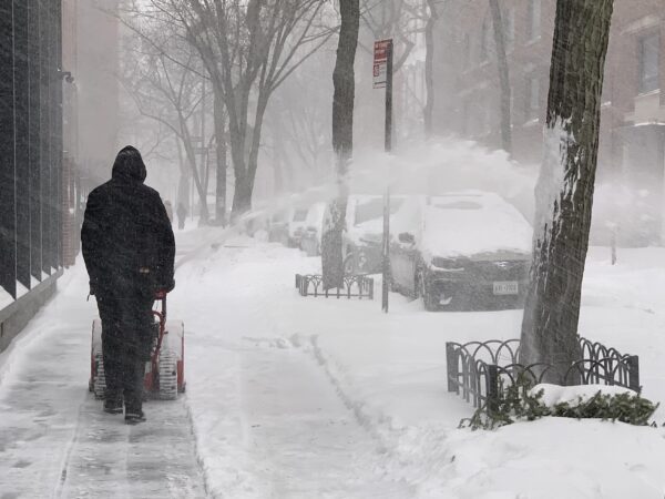A man using a snowblower cleans up the sidewalk in Brooklyn Heights. Photo: Mary Frost, Brooklyn Eagle