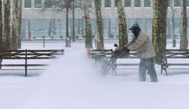 A New York City Parks Department worker fights the snow and wind as he tries to clear the walking path in Cadman Plaza Park. Photo: Mary Frost, Brooklyn Eagle