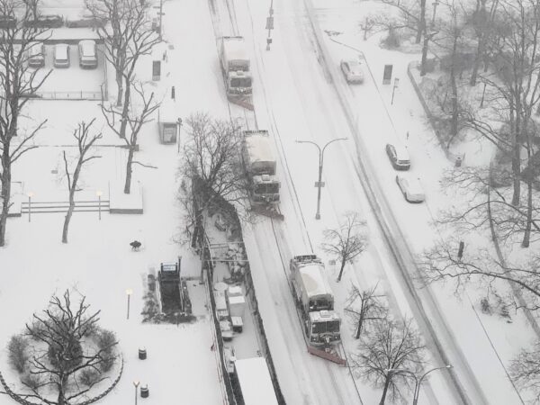Whiteout: A team of snowplows makes its way along Cadman Plaza West at the start of Winter Storm Fern. Photo: Mary Frost, Brooklyn Eagle