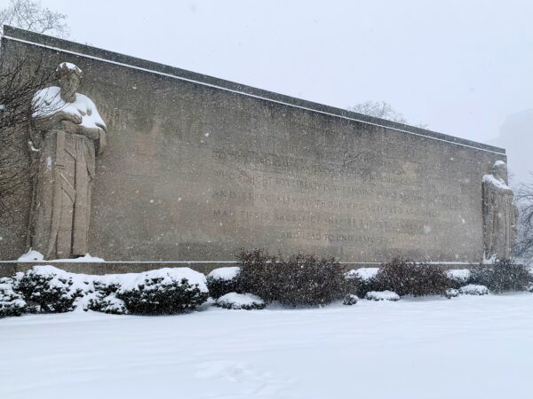 The limestone figures at the Brooklyn War Memorial in Cadman Plaza Park seem to shiver under shawls of snow. The statues were designed by sculptor Charles Keck, and represent "War" and "Victory and Family." Photo: Mary Frost, Brooklyn Eagle