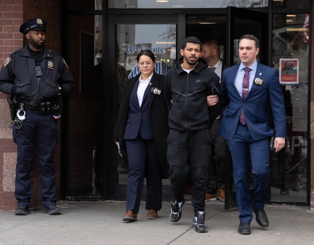 Alberto Frias is pictured in police custody leaving the NYPD's 44th Precinct stationhouse in the Bronx on Wednesday, Feb. 18, 2026. (Barry Williams/ New York Daily News)