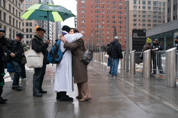 Father Fabian Arias gives out ashes outside the Jacob Javits Federal Building Wednesday, Feb. 18, 2026 in Manhattan, New York. (Barry Williams/ New York Daily News)