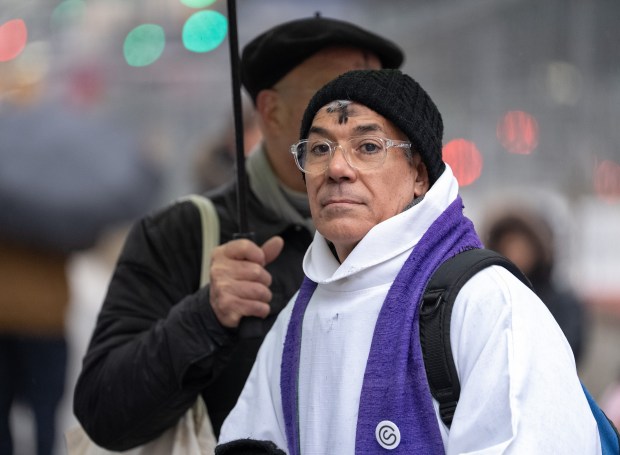Father Fabian Arias gives out ashes outside the Jacob Javits Federal Building Wednesday, Feb. 18, 2026 in Manhattan, New York. (Barry Williams/ New York Daily News)