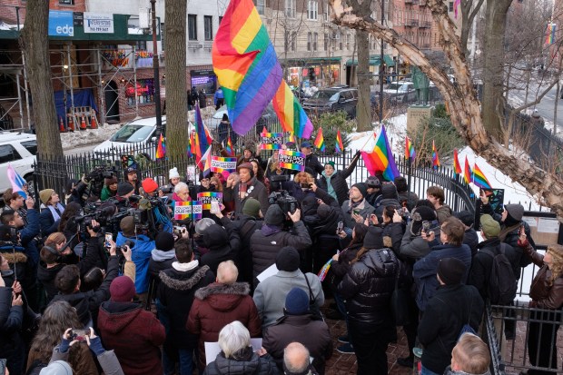 Protesters fill Christopher Park, site of the Stonewall National Monument, in Greenwich Village, Manhattan on Tuesday, Feb. 10, 2026, after a rainbow Pride flag was was removed because of a Trump administration directive. (Gardiner Anderson / New York Daily News)