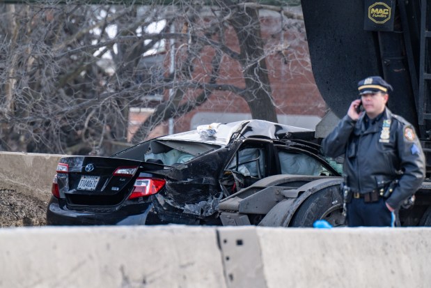 Police investigate after a livery driver was killed in a crash with a tractor-trailer on the Long Island Expressway in Queens on Feb. 6, 2026. (Theodore Parisienne / New York Daily News)