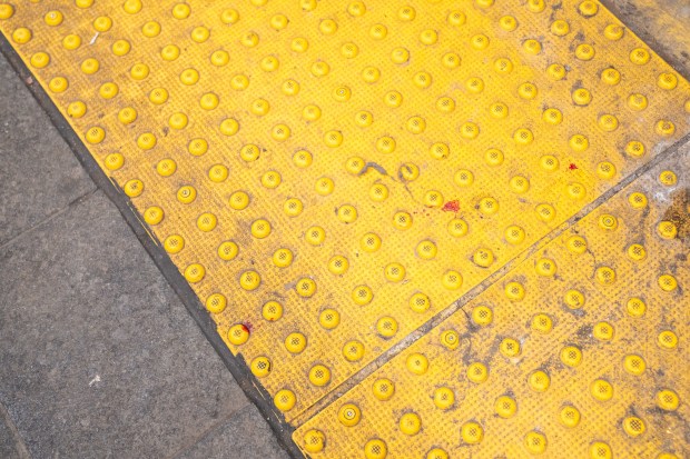 Blood is pictured on the subway platform after a 51-year-old woman was shoved onto the tracks and a 43-year-old woman was punched in the face during an apparent random attack at the 53rd Street/4th Avenue 'R' train stop in Brooklyn on Saturday, Feb. 14, 2026. (Theodore Parisienne / New York Daily News)