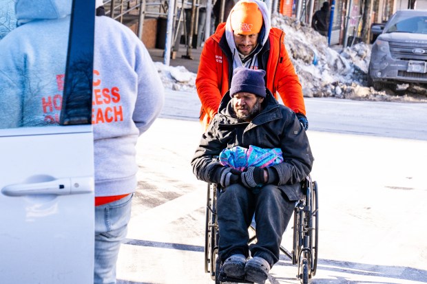 A Homeless Outreach team looking for vulnerable New Yorkers outside in the frigid temperatures was observed assisting a man in a wheelchair at the West 163rd Street / Amsterdam Avenue 'C' Train Station in Manhattan on Monday February 9, 2026. 0832. The man accepted their assistance, whereupon he was wheeled two blocks away and placed inside their warm van parked on Broadway. (Theodore Parisienne / New York Daily News)