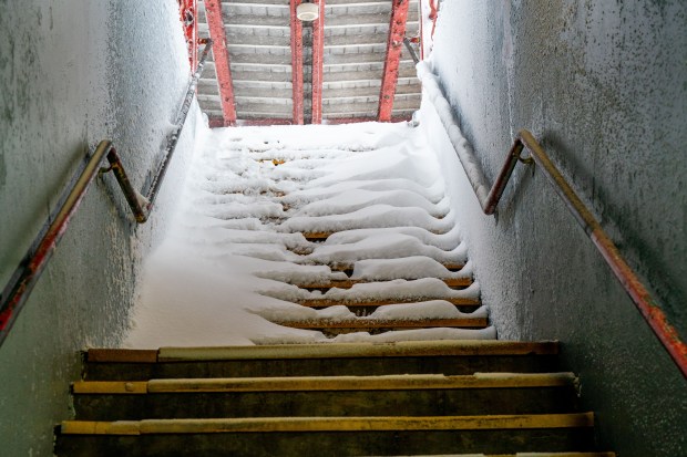 (Snow and ice covered steps lead up to the Long Island Rail Road Rosedale Train Station platform in Queens) Nor'easter blizzard slams New York City on Monday February 23, 2026. 0731. (Theodore Parisienne / New York Daily News)
