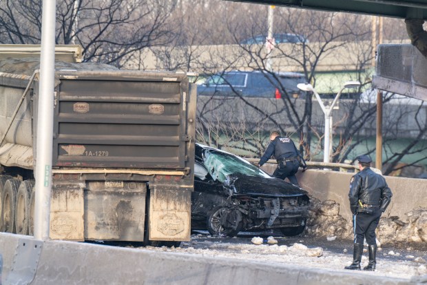Police investigate after a 50-year-old driver was killed when he rear-ended a tractor-trailer on the Long Island Expressway in Queens early Friday. 