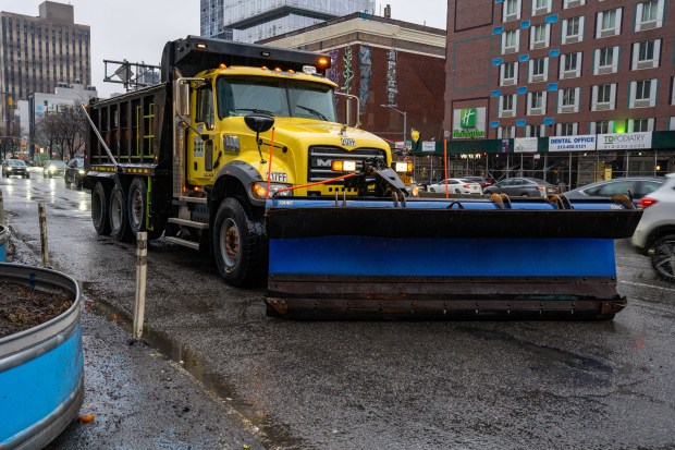 (A NYCDOT snow plow sits ready on Delancey Street) Nor'easter set to pummel New York City on Sunday February 22, 2026. 0820. (Theodore Parisienne / New York Daily News)