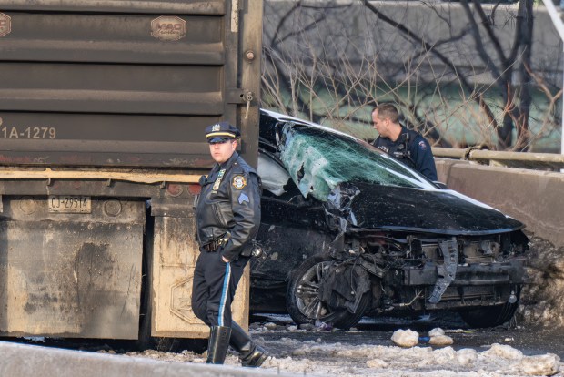 Police investigate after a 50-year-old driver was killed when he rear-ended a tractor-trailer on the Long Island Expressway in Queens early Friday.