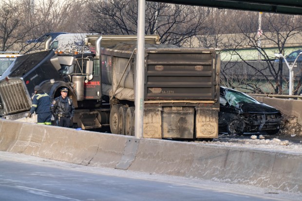 Police investigate after livery driver Carlos Asitimbay, 50, was killed in a crash with a tractor-trailer on the Long Island Expressway in Queens on Feb. 6.