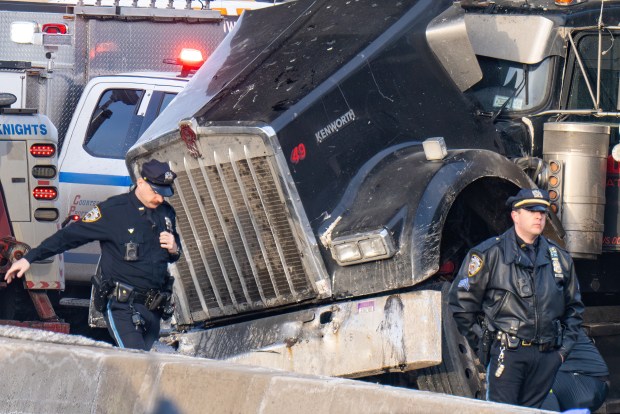 Police investigate after a 50-year-old driver was killed when he rear-ended a tractor-trailer on the Long Island Expressway in Queens early Friday.