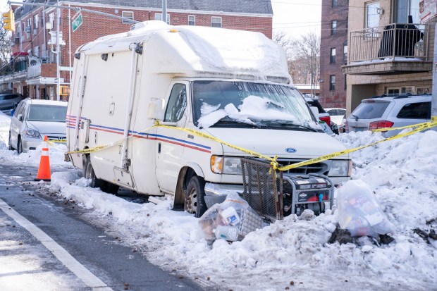A man and a dog were pronounced dead on scene after they were found unconscious and unresponsive inside a mobile veterinary van parked on 65th Ave. in Queens on Sunday, Feb. 1, 2026. (Theodore Parisienne / New York Daily News)