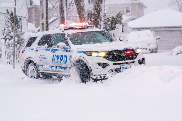 (A NYPD SUV navigates the snowdrift on the Streets of Rosedale, Queens) Nor'easter blizzard slams New York City on Monday February 23, 2026. 0731. (Theodore Parisienne / New York Daily News)