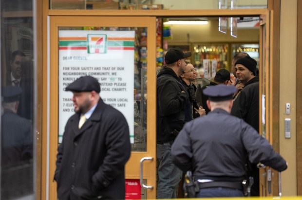 NYPD detectives and officers investigate a fatal shooting inside a 7-Eleven at the corner W. 39th St. and 8th Ave. in Manhattan on Thursday, Feb. 11, 2026. (Barry Williams/ New York Daily News)