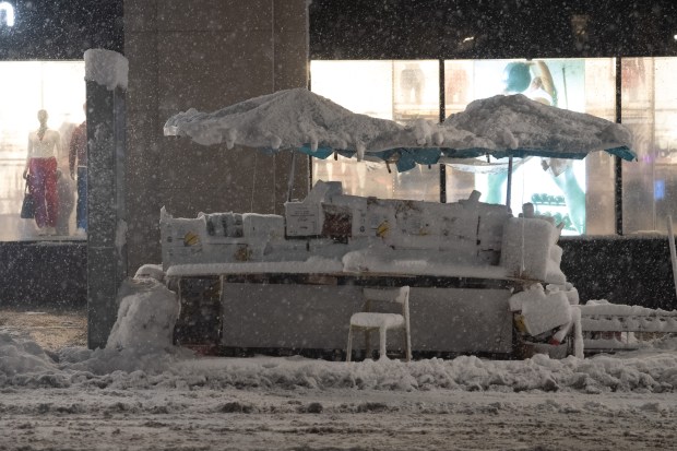 An unattended fruit stand collects snow in on E. 86th St. on the Upper East Side of Manhattan during a snow storm on Sunday, Feb. 22, 2026 in New York City. (Barry Williams/ New York Daily News)