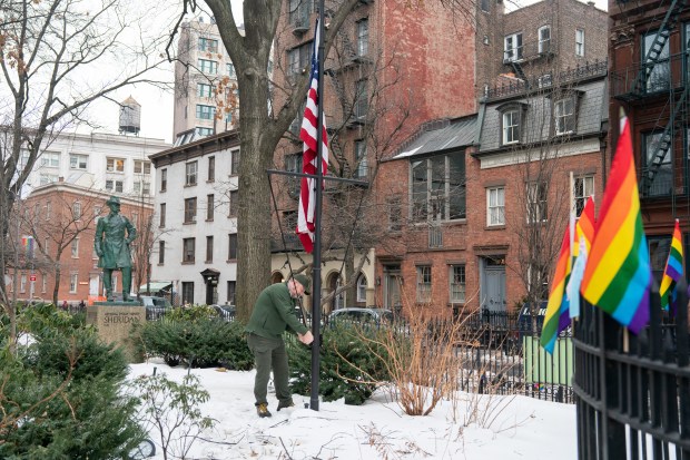 A National Park Service employee raises a U.S. Flag at the Stonewall National Monument in Manhattan, New York, on Wednesday, Feb. 11, 2026. (Barry Williams/ New York Daily News)
