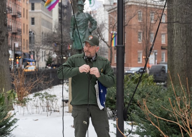 A National Park Service employee raises a U.S. Flag at the Stonewall National Monument in Manhattan, New York, on Wednesday, Feb. 11, 2026. (Barry Williams/ New York Daily News)