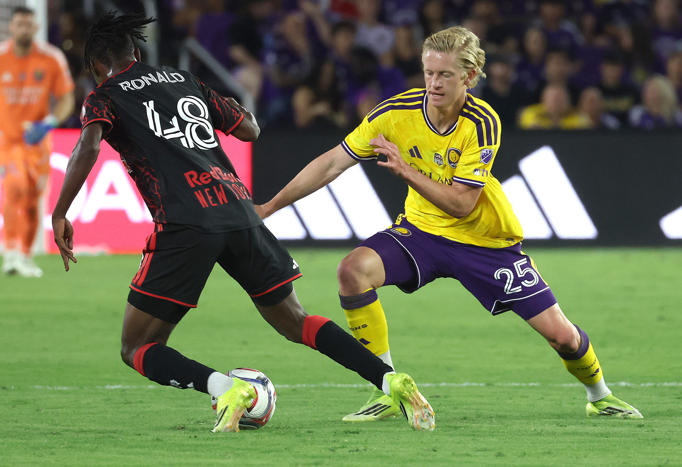 Orlando player Colin Guske (25) tries to get the ball...
