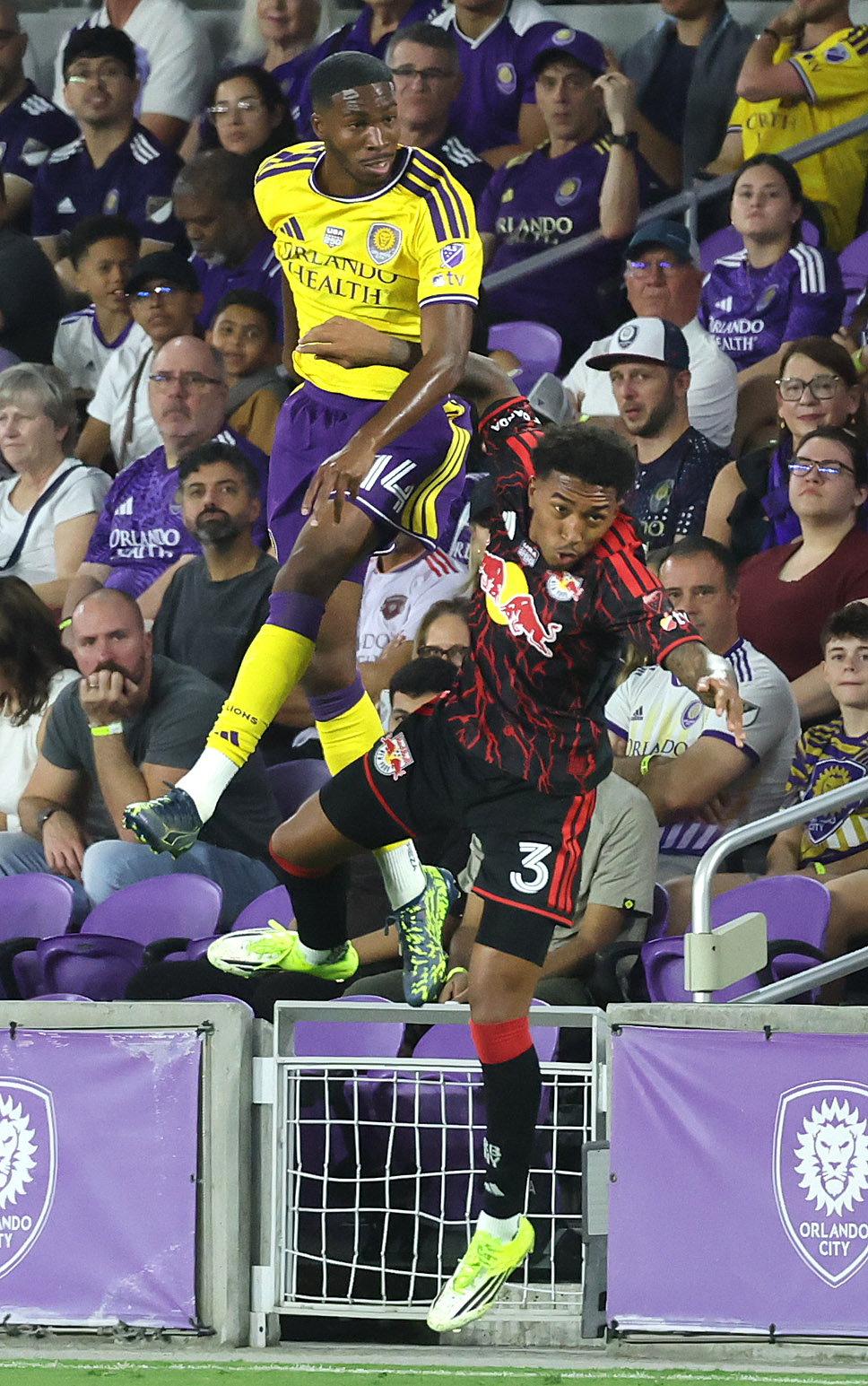 Orlando player Tyrese Spicer (14) leaps over New York player...