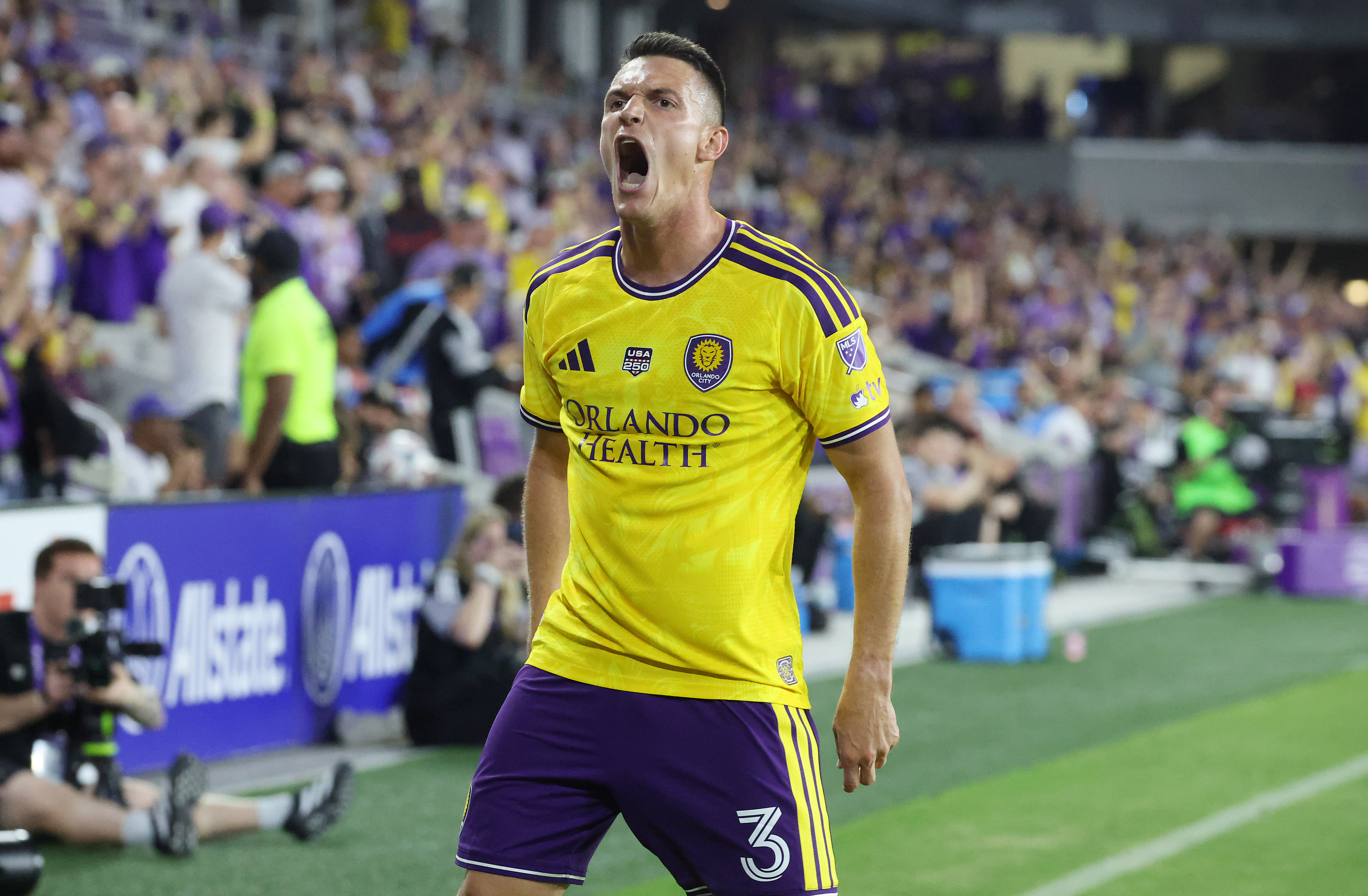 Orlando City player Adrian Marin screams in celebration during the...