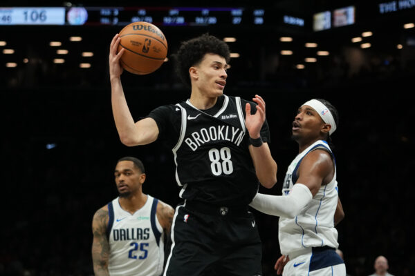 Brooklyn Nets' Nolan Traore (88) rebounds the ball during the second half of an NBA basketball game against the Dallas Mavericks Tuesday, Feb. 24, 2026, in New York. (AP Photo/Frank Franklin II)