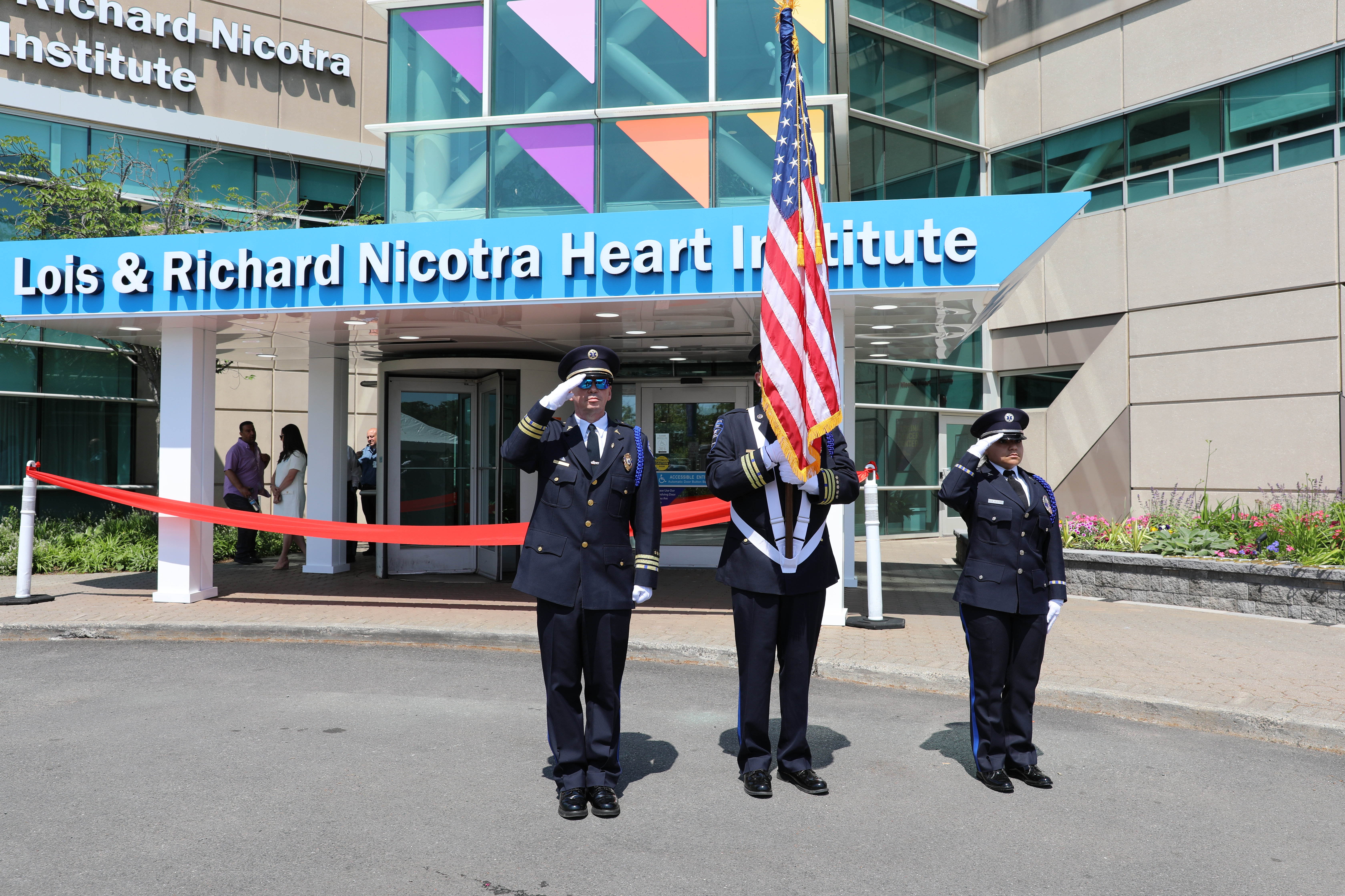 The United States flag, the broad range of medical staff and patients, and the unmistakable sense of care are all embodied in this moment of a flag salute. Scenes from the Lois and Richard Nicotra ribbon cutting of the newly renovated Lois and Richard Nicotra Heart Institute on June 3, 2025. (Advance/SILive.com | Jan Somma‑Hammel)