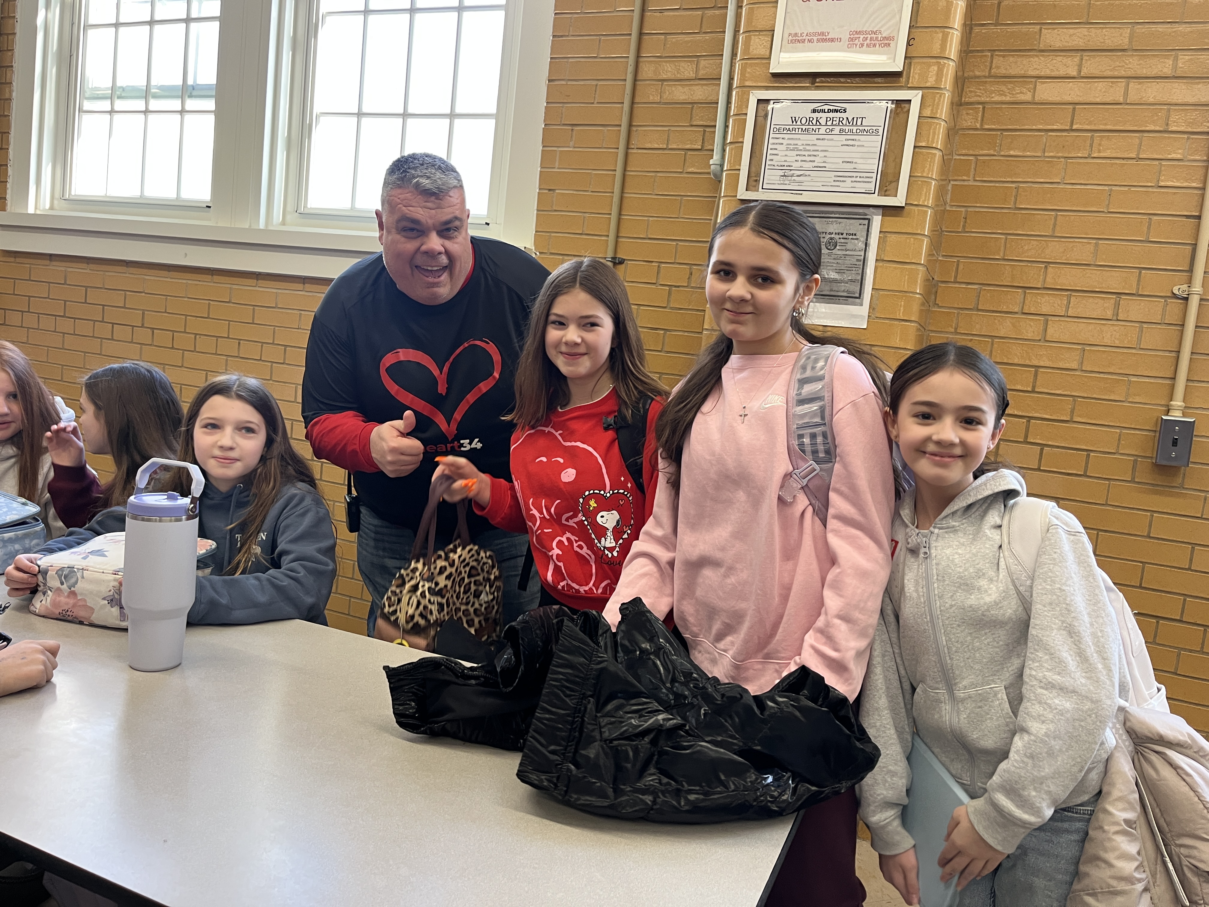 Millions of schools across the United States, including some on Staten Island, like I.S. 34 in Tottenville, took part in National No One Eats Alone Day. The lunchtime program, created by the nonprofit Beyond Differences, aims to make cafeterias more welcoming by encouraging students to connect with classmates they might not usually sit with. Today's lunch also featured dancing. (Advance/SILive.com | Jan Somma-Hammel)