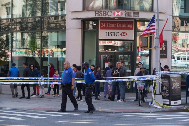 NYPD and FDNY clean up the crime scenes at 2 Bowery Street and Catherine and East Broadway in Chinatown where Randy Santos, 24, allegedly bludgeoned five homeless men as they slept on Saturday, October 5, 2019. (Clarissa Sosin for New York Daily News)